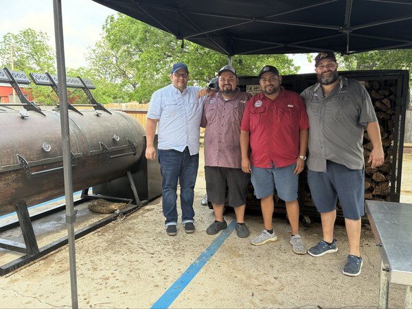The Humo Prime Barbecue team in front of their offset smoker